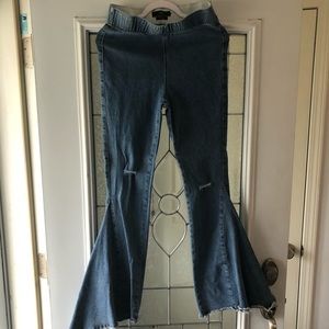 Distressed super flare jeans